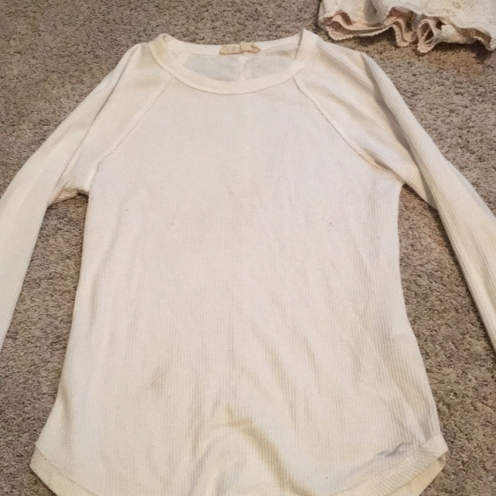Tight white long sleeved t-shirt